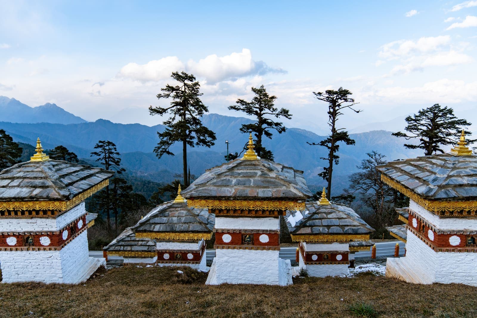 The 108 chortens of Dochula Pass against the Himalayas
