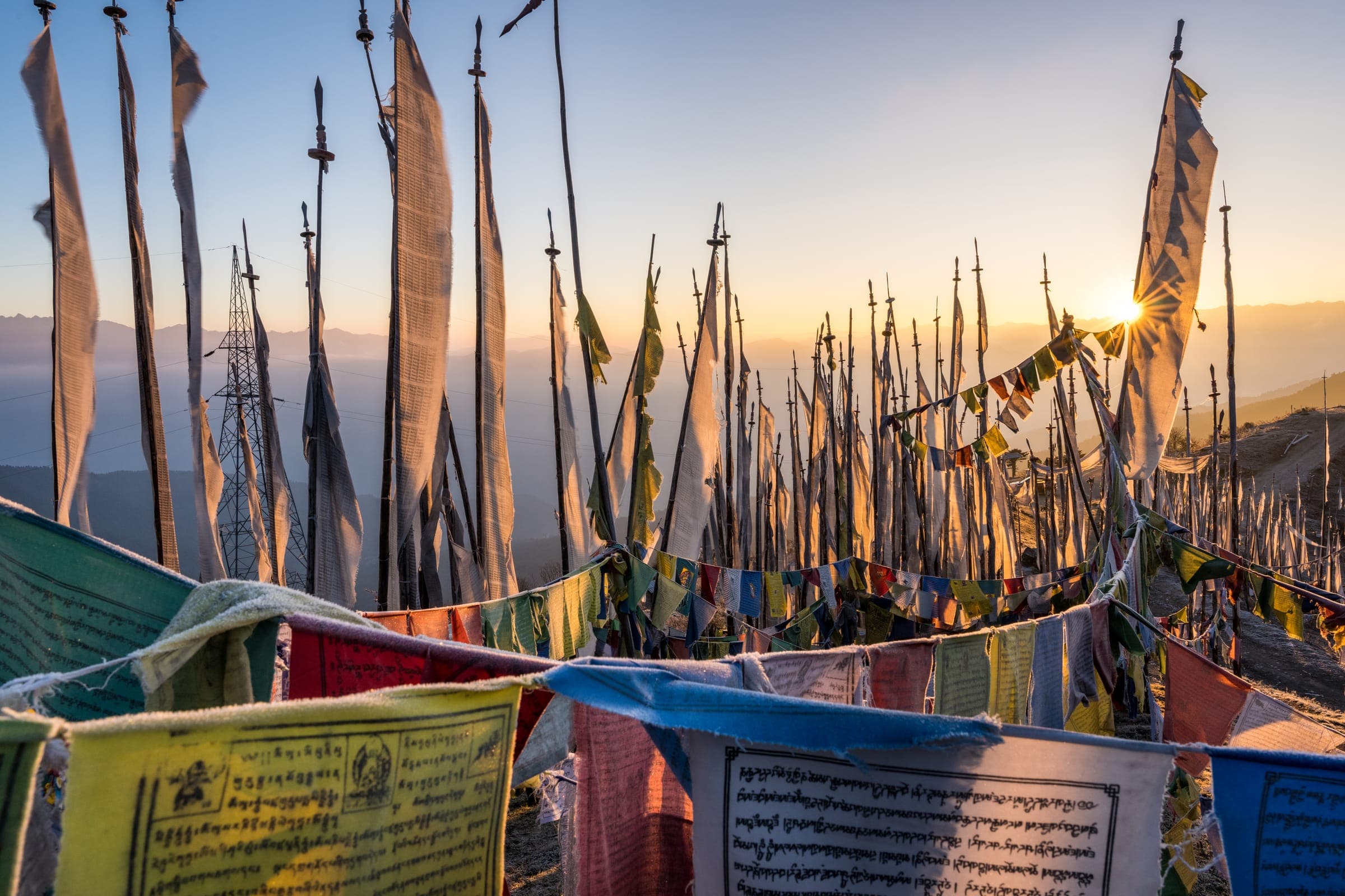 Prayer flags glowing in the setting sun
