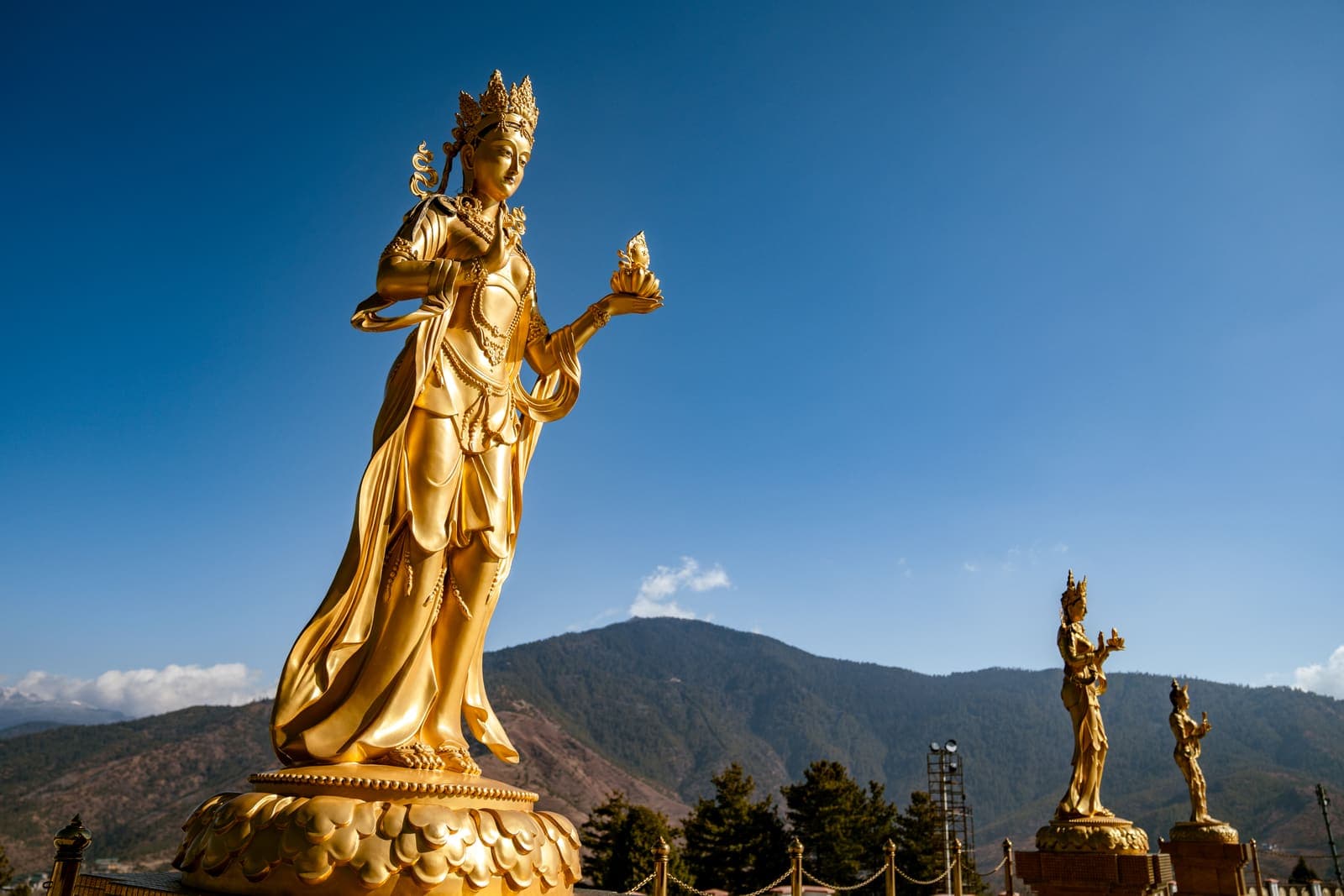 A golden statue overlooking the Thimphu valley