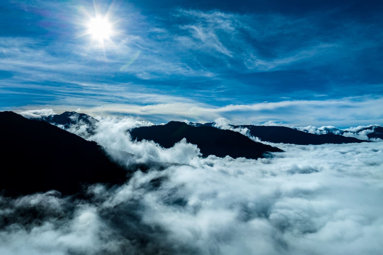 The sun above a sea of cloud in the Himalayas