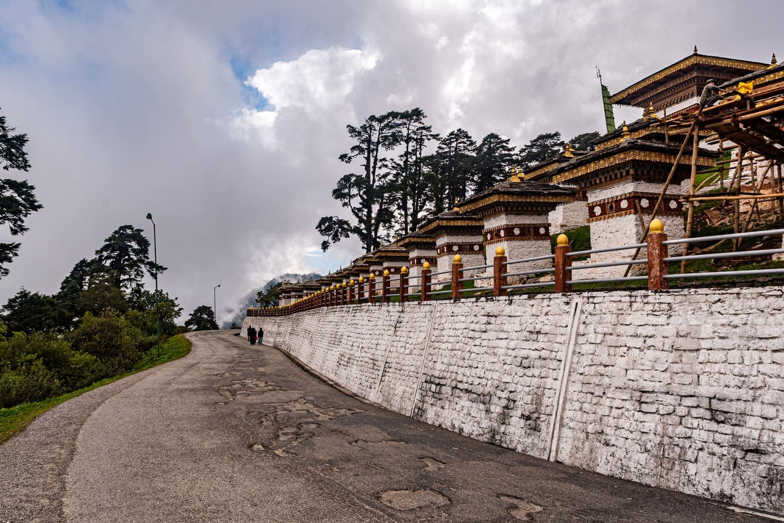 The road past the wall of chortens at Dochula Pass
