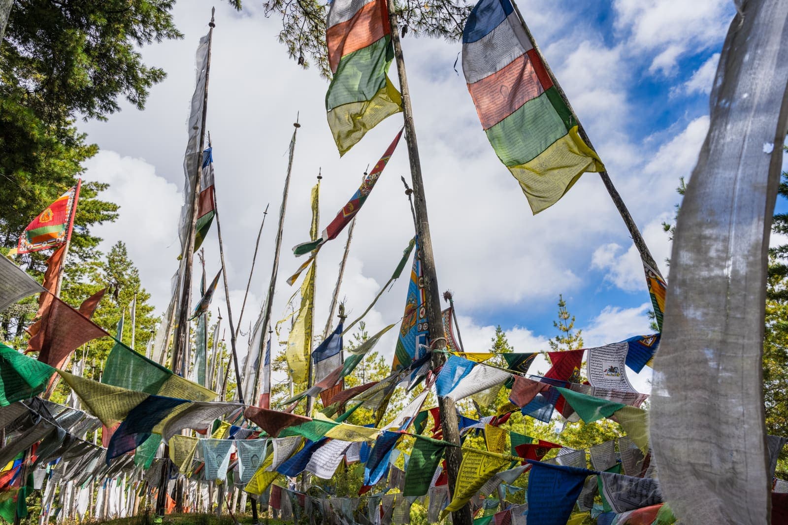 Prayer flags fluttering above a Bumthang temple