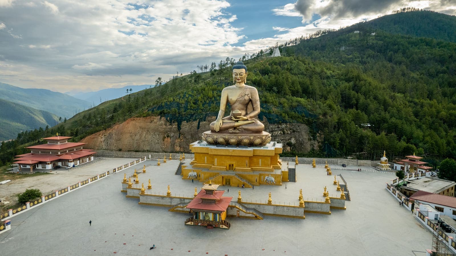 The Buddha Dordenma statue with mountains behind