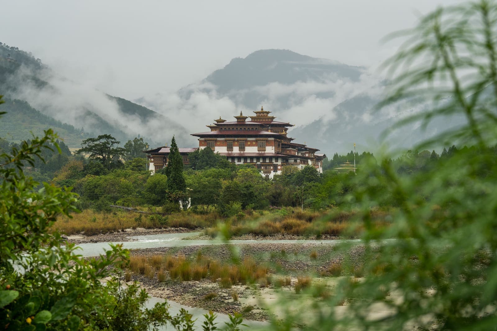 Punakha Dzong across the river among green hills
